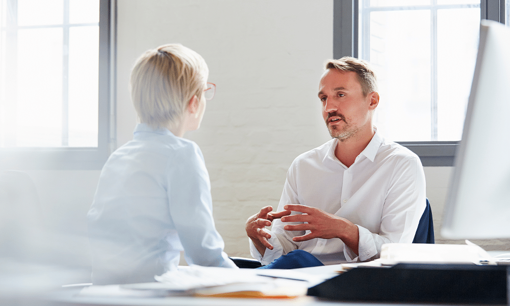 A salesperson talking to a client.